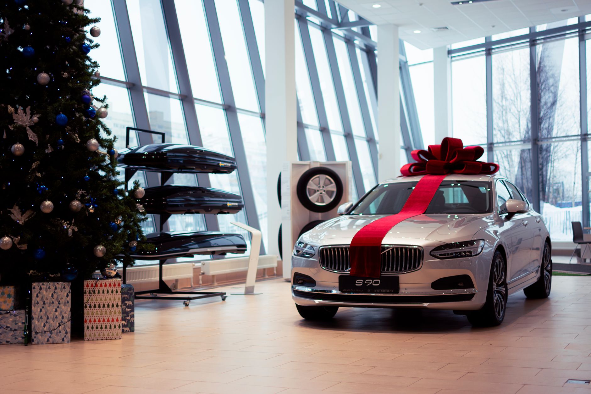 Modern car dealership showroom displaying new vehicle models