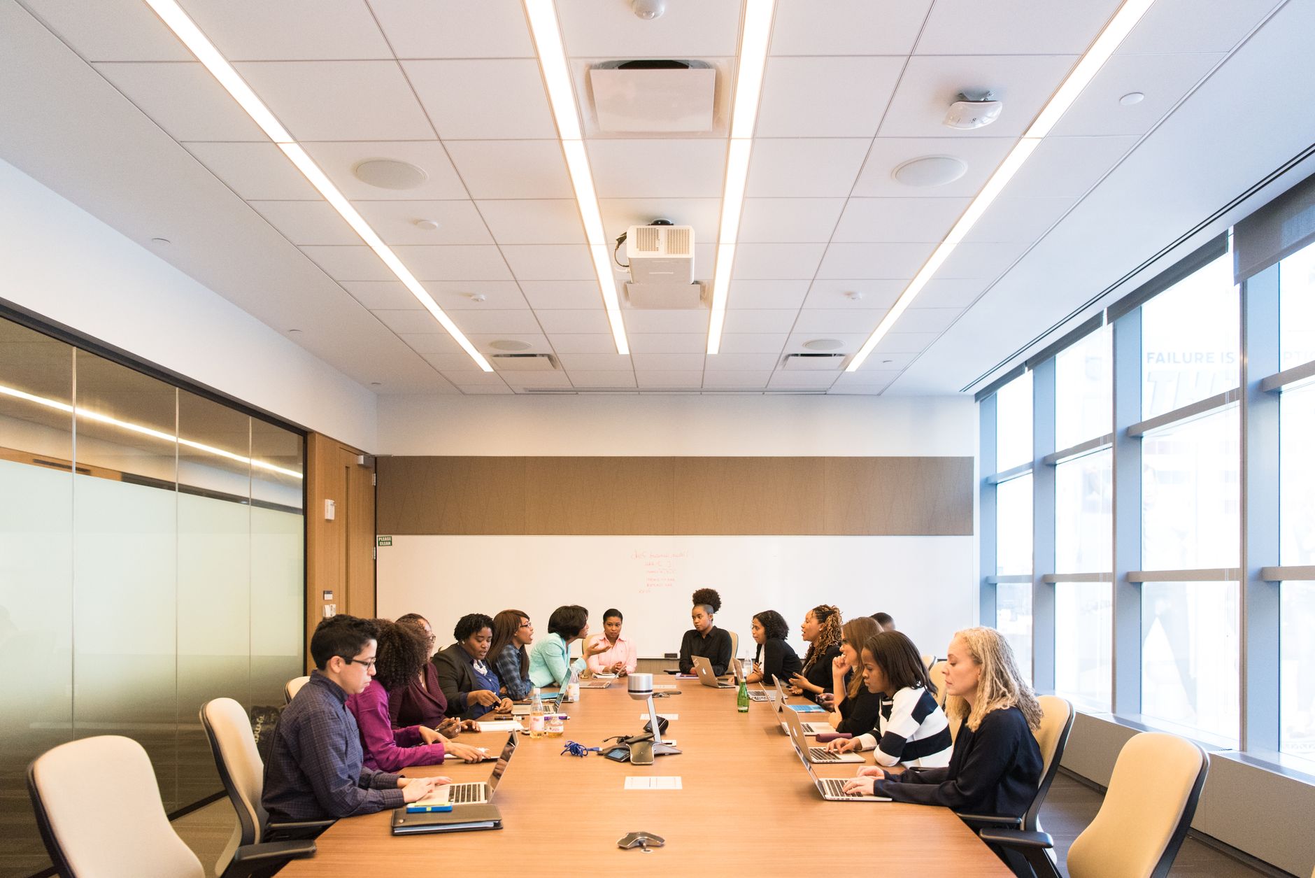 Business professionals reviewing data in a corporate technology conference room