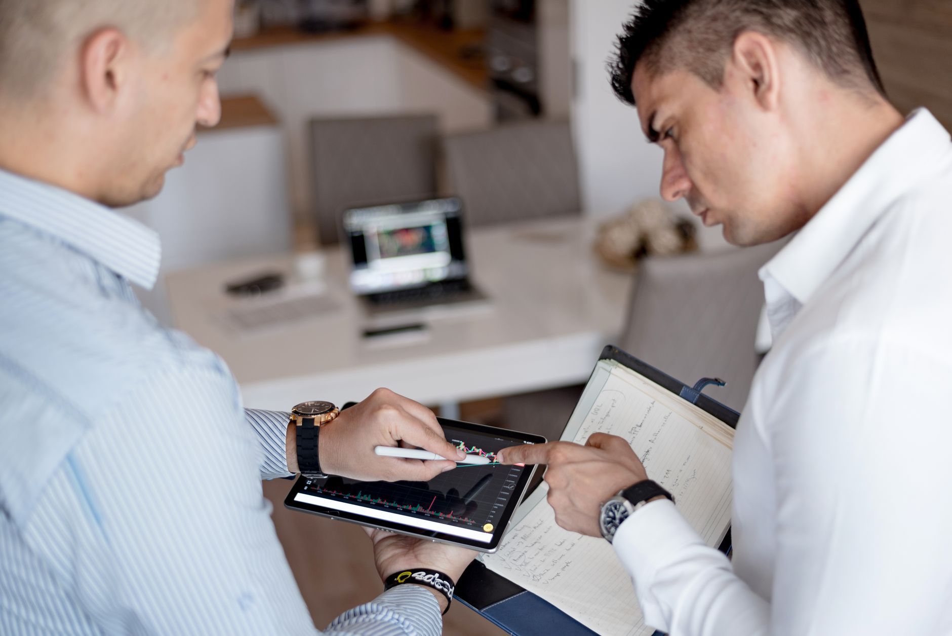 Business professionals in a formal meeting discussing investment strategy and corporate lending decisions