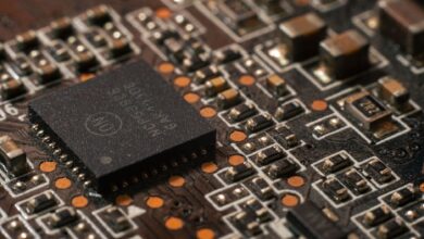 Close-up of a semiconductor chip on a circuit board representing AI hardware development