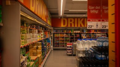 Wide retail store aisle with product shelves representing consumer goods advertising competition