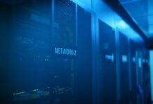 Rows of servers in a modern data center with blue lighting