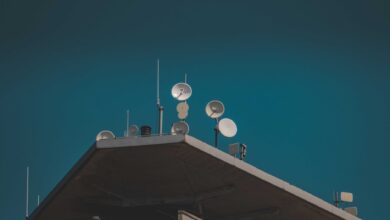 Large satellite dish pointed toward a clear blue sky representing broadband connectivity infrastructure