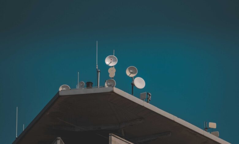 Large satellite dish pointed toward a clear blue sky representing broadband connectivity infrastructure