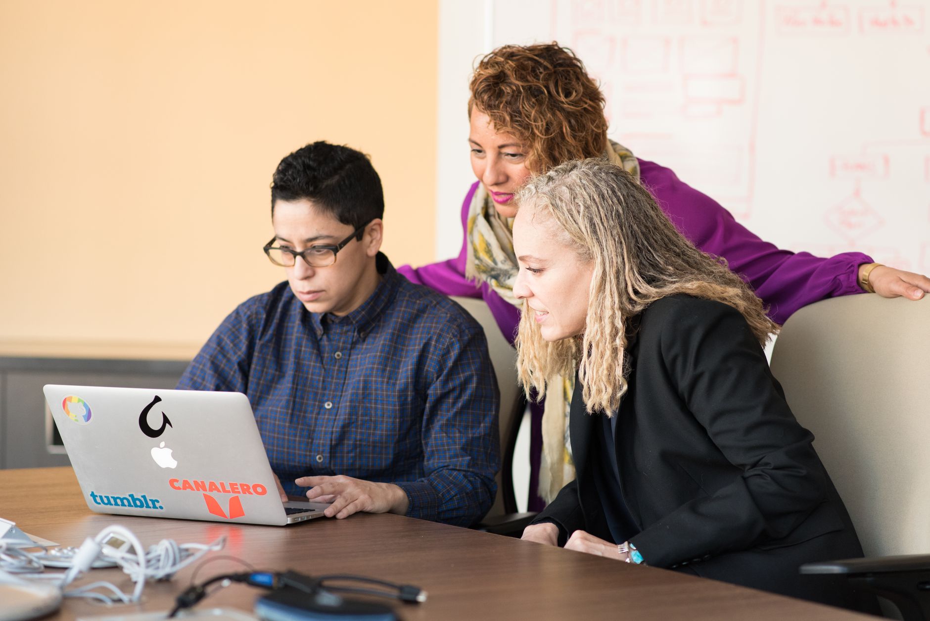 Professional reviewing AI-assisted software tools during a business meeting