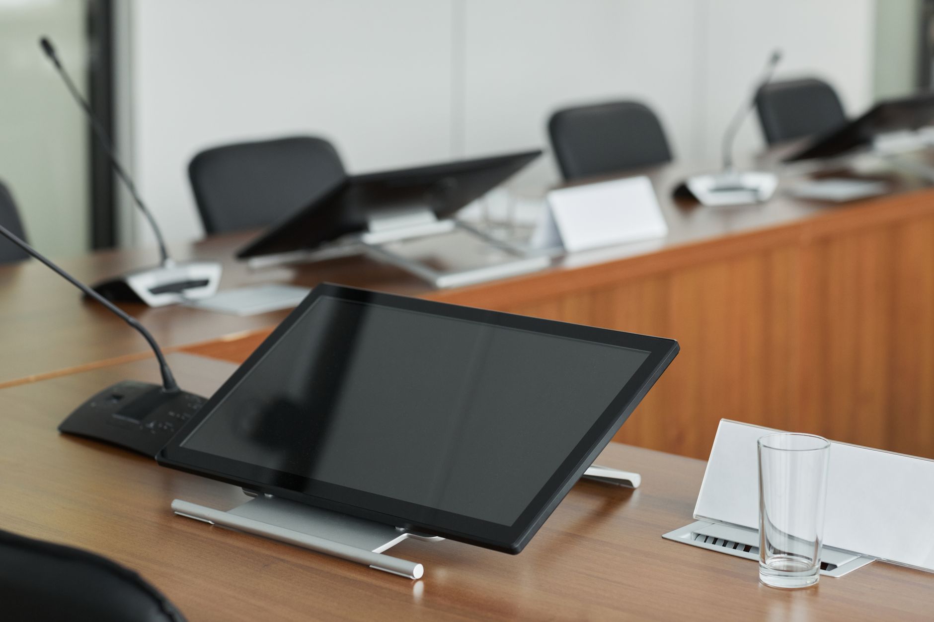 Executive team discussing technology platform decisions in a conference room setting